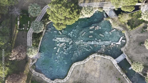 Cinematic aerial drone video of Hierapolis Antik Kenti and Pamukkale travertines in Denizli, Turkey, showcasing the Roman theater, columns, ruins, and dramatic landscape from above.