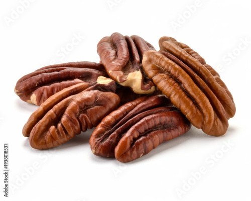 Piled pecan nuts on white background
