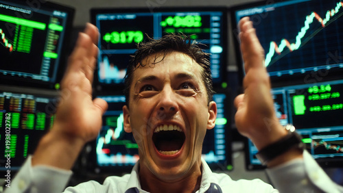 A trader yells excitedly, gesturing at rising stock charts in a busy trading room.