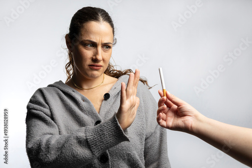 Tableau sur toile Woman refusing cigarette, choosing healthy living lifestyle