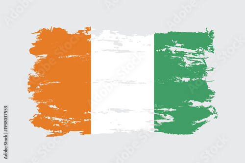 Ivory Coast flag painted with a brushstroke. Abstract concept. National flag in grunge style.