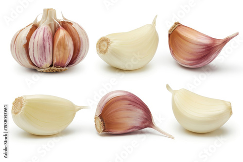 Various garlic bulbs and cloves on white background