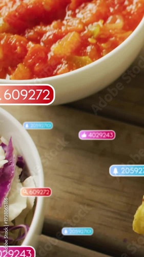 Vertical video: Camera shifting right, zooming salsa bowl as badges piling, showing sauce for food