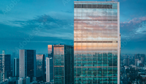 Obraz na plátně Modern skyscraper reflecting sunrise over Chengdu cityscape