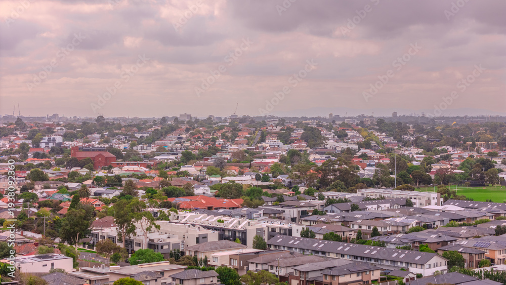 Obraz premium Panoramic Aerial Drone view of Inner Suburbs of Melbourne housing, roof tops, the streets and the parks, the roads and trees of Ascot Vale Moonee Ponds Brunswick Essendon and Maribyrnong in VIC Victor