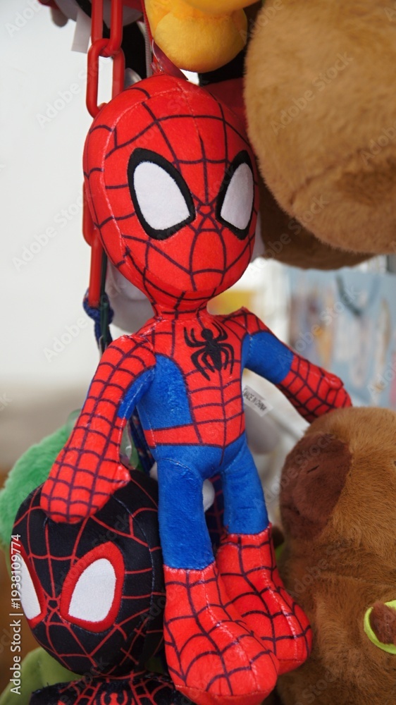 Obraz premium Spider-Man plush toy hanging with other characters