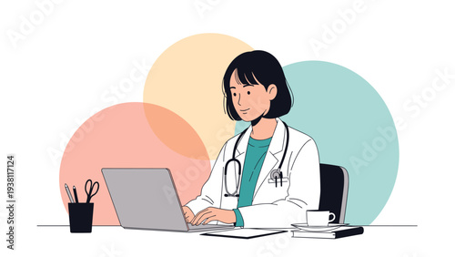 Female doctor in a white lab coat sitting at a desk and working on a laptop computer with coffee and documents nearby.