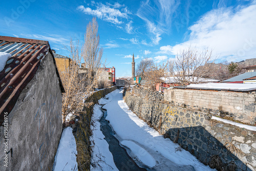 The scenic view of Kars, the old streets and houses of Kars  in winter on a snowy day, in Turkey. 