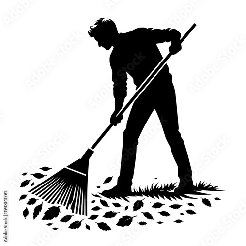 Man raking leaves in garden with autumn foliage