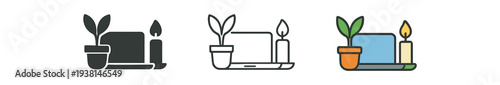 work from home closed laptop with candle and plant of workday