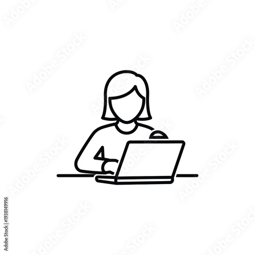 Woman working on laptop at desk in a minimalist office environment