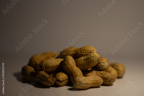 Photography A pile of in shell peanuts / A heap of peanuts / A mound of peanuts