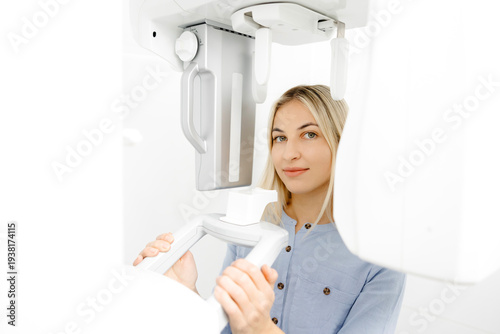 Young woman undergoing a dental panoramic radiography exam