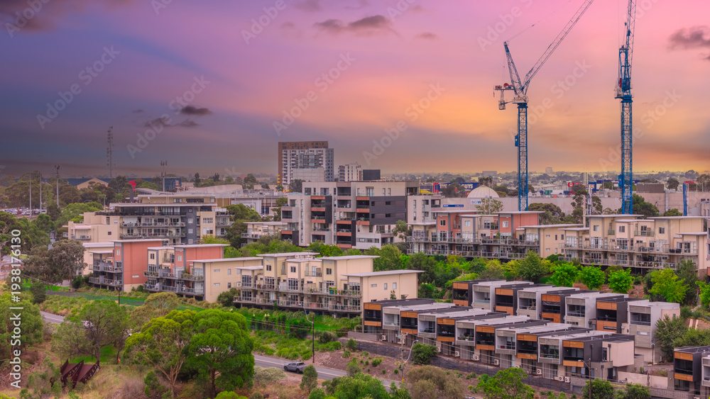 Fototapeta premium Panoramic Aerial Drone view of Inner Suburbs of Melbourne housing, roof tops, the streets and the parks, the roads and trees of Ascot Vale Moonee Ponds Brunswick Essendon and Maribyrnong in VIC Victor