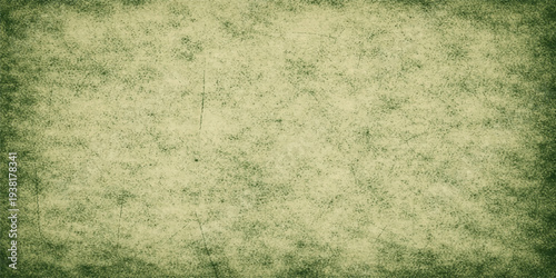 A vintage grunge backdrop featuring green grass growing over an aged brown parchment paper texture with a stained antique aesthetic