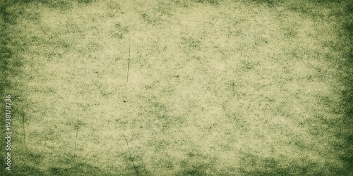 A vintage grunge background featuring green grass over aged brown parchment with a stained antique paper texture for a worn retro design
