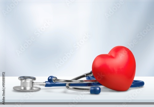 Tableau sur toile Medical Stethoscope and red heart on desk