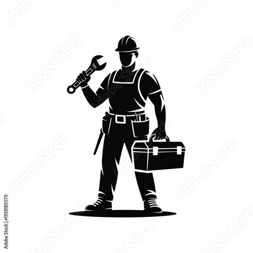 Mechanic holding wrench and toolbox standing confidently in workwear and safety gear on white background