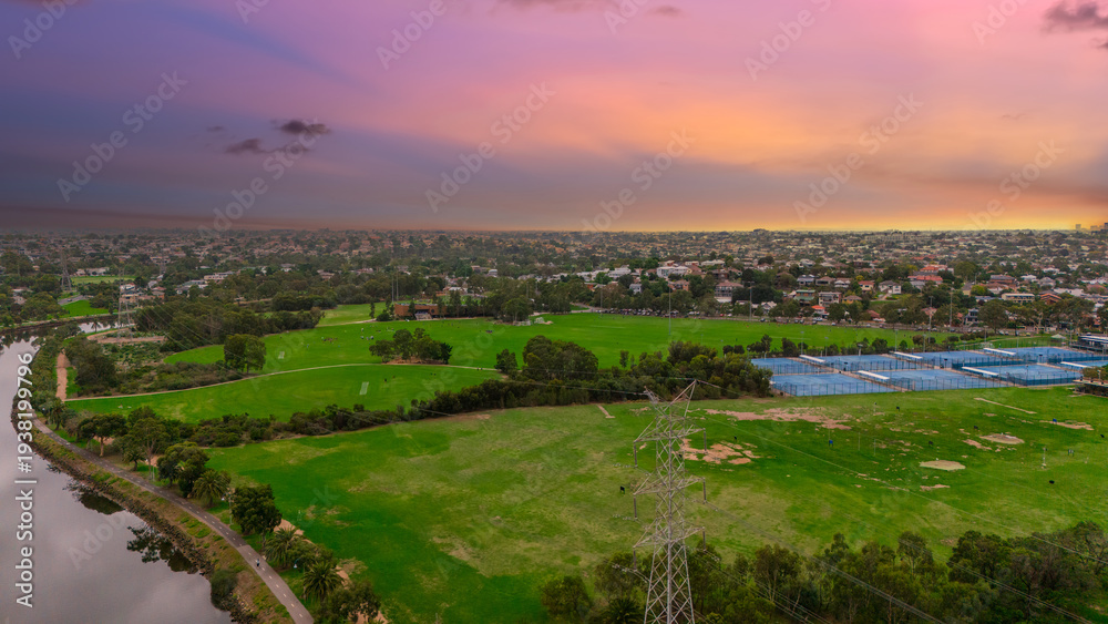 Fototapeta premium Panoramic Aerial Drone view of Inner Suburbs of Melbourne housing, roof tops, the streets and the parks, the roads and trees of Ascot Vale Moonee Ponds Brunswick Essendon and Maribyrnong in VIC Victor
