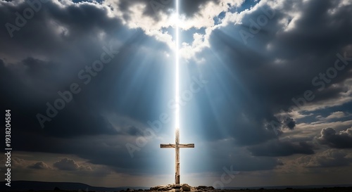 Wooden cross illuminated by dramatic light against stormy sky