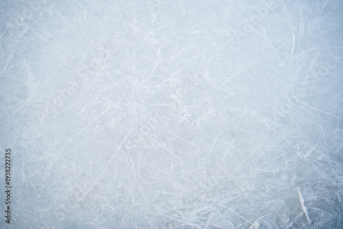 Natural scratched ice at the ice rink as texture or background for winter composition