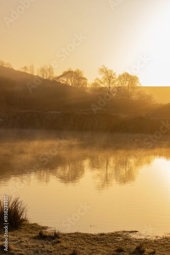 Misty sunrise at Cawfields Quarry on the Hadrians Wall trail in Northumberland, UK