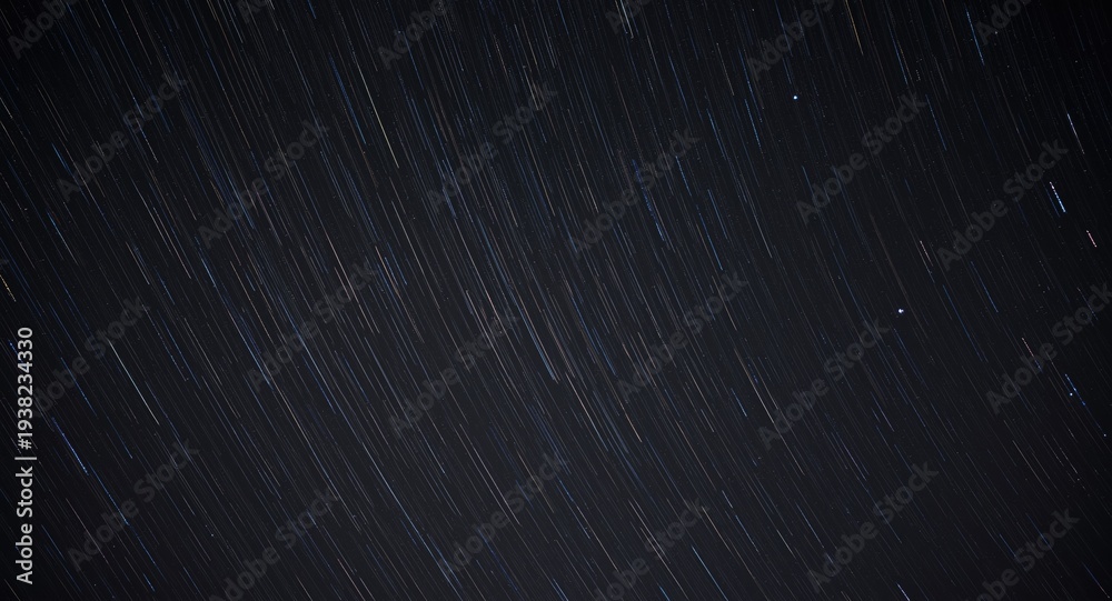 Fototapeta premium Dazzling meteor trails glowing against a pitch black backdrop