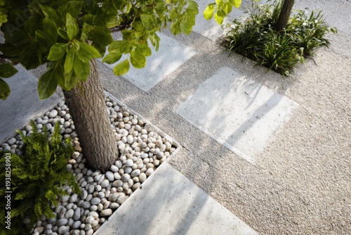 A picturesque natural setting featuring a variety of trees, stones, and lush plants in a beautifully landscaped area, illuminated by daylight