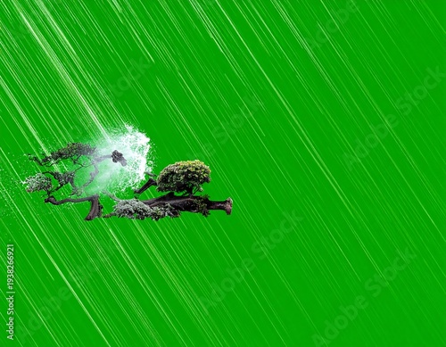 Tree branches, one disintegrating in a bright flash of light, contrasting against a vibrant green, rainy backdrop