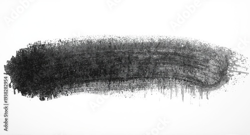 Black streak created by textured grunge graphite pencil on clear white background showing artistic depth