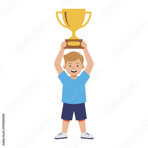 Young boy holding trophy aloft in triumph and celebration