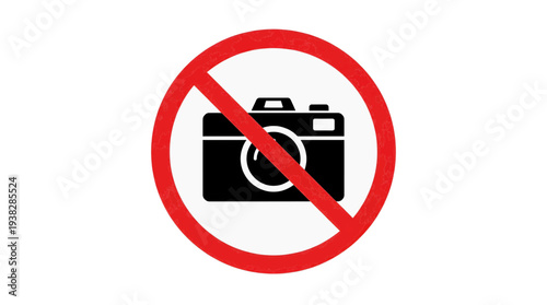 A red prohibition sign featuring a black camera icon is prominently displayed on a white background, indicating no photography allowed