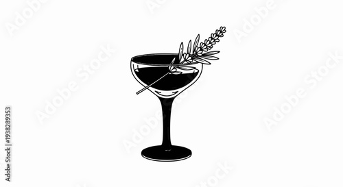 Elegant glass holding a dark beverage with a sprig of greenery