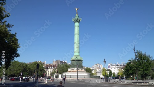 Iconic July Column standing in the center of the Bastille Square surrounded by classic Parisian architecture, city of Paris, France.