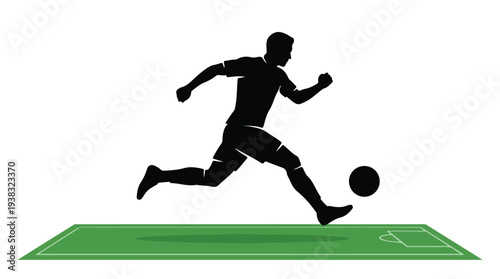 Silhouette of a soccer player running and kicking a football on a field