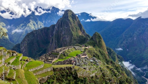 Breathtaking vista of ancient ruins nestled amidst towering mountains and lush, vibrant green landscapes