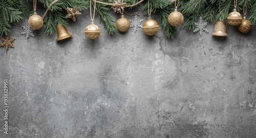 Festive garland border featuring Christmas ornaments on grey stone textured background