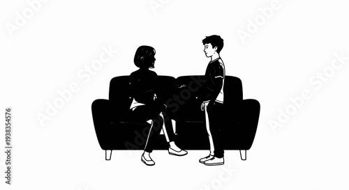 Two people conversing on a couch, one seated, the other standing