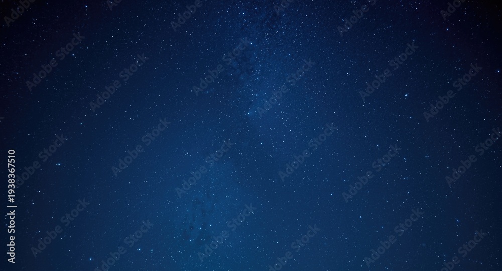 Obraz premium Captivating star studded night sky with sparkling cosmic lights on a rich blue background