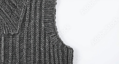 Close detail of a wool sleeveless garment with knit texture