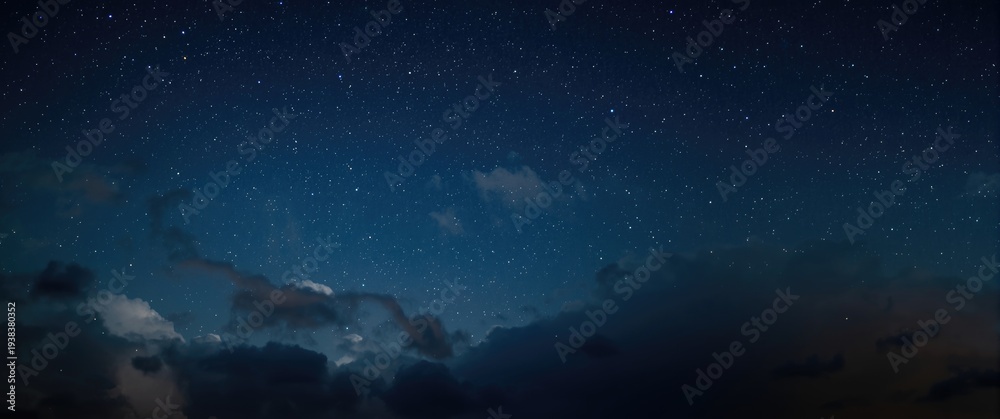 Fototapeta premium celestial stars illuminating a cloudy night sky