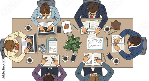 High-angle view of a diverse business team working together around a table with laptops, notebooks, and coffee cups during a meeting.