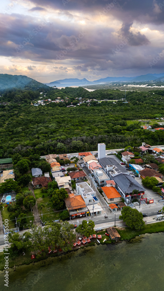 Fototapeta premium Aerial Waterfront Village Boats Restaurants Atlantic Forest Hills Lagoa Da Conceicao Florianopolis Brazil Island Coastal Scenery Santa Catarina South America Travel Destination