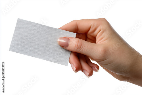 A hand holding a blank white ticket card with serrated edges, iolated on white background.