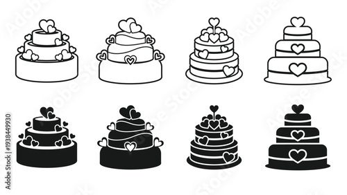A set of black and white wedding cakes with hearts on them