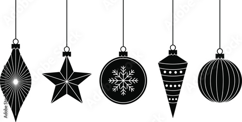 Set of black Christmas ball ornament silhouettes hanging on strings featuring stars snowflakes and stripes for holiday winter season decorations