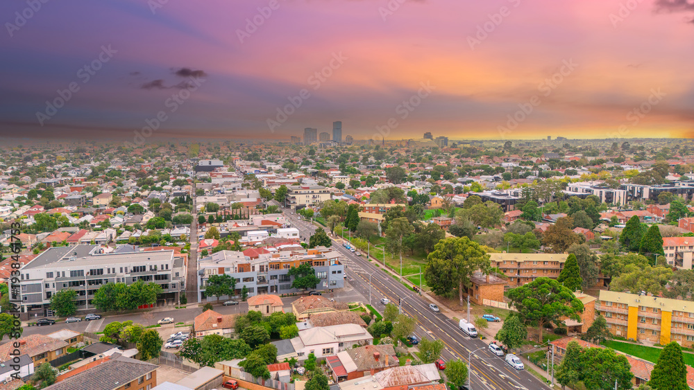 Fototapeta premium Panoramic Aerial Drone view of Inner Suburbs of Melbourne housing, roof tops, the streets and the parks, the roads and trees of Ascot Vale Moonee Ponds Brunswick Essendon and Maribyrnong in VIC Victor