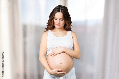 Free Download Happy pregnant woman touching her belly - GFXLoad