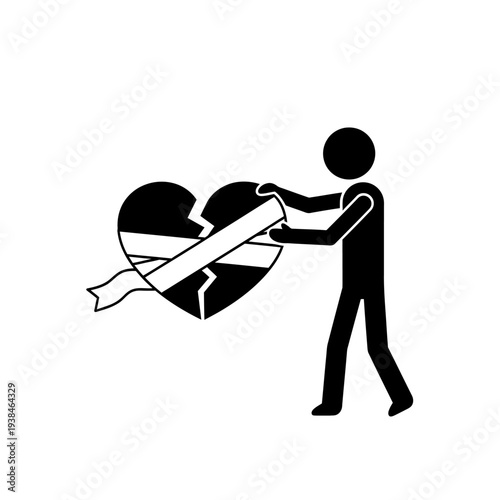 Person repairing a broken heart with a bandage in a symbolic gesture