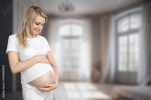 Happy pregnant woman touching her belly Free Download Happy pregnant woman touching her belly - GFXLoad